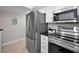 Modern kitchen features stainless steel appliances and dark granite countertops at 700 Lyndhurst St # 1024, Dunedin, FL 34698