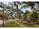 Manicured grounds, and walking paths showcasing mature trees and lush gardens for peaceful living at 700 Lyndhurst St # 1024, Dunedin, FL 34698