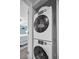 Close up of the stackable washer and dryer in laundry closet at 700 Lyndhurst St # 1024, Dunedin, FL 34698