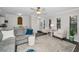 Spacious living room with modern furnishings, hardwood floors, and an abundance of natural light at 700 Lyndhurst St # 1024, Dunedin, FL 34698