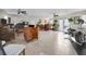 Spacious living room featuring tile floors, ceiling fans, and ample natural light at 700 Lyndhurst St # 1024, Dunedin, FL 34698