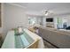 Bright living room with a dining table, comfortable seating, and view of the outside, creating a relaxing space at 700 Lyndhurst St # 1024, Dunedin, FL 34698