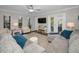 Bright and airy living room featuring a plush sectional, natural light, and a comfortable seating area at 700 Lyndhurst St # 1024, Dunedin, FL 34698
