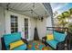Relaxing patio featuring comfortable seating, a colorful rug, and a peaceful outdoor setting at 700 Lyndhurst St # 1024, Dunedin, FL 34698