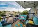Inviting patio with comfortable seating, a vibrant rug, string lights, and a view of the surrounding area at 700 Lyndhurst St # 1024, Dunedin, FL 34698
