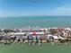 Waterfront home near beach with boat dock, pool and patio highlighted with a red arrow at 8505 Blind Pass Dr, Treasure Island, FL 33706