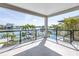 A spacious balcony offers tranquil waterfront views, a refreshing breeze, and relaxing outdoor living at 8505 Blind Pass Dr, Treasure Island, FL 33706