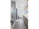 Stylish bathroom with glass shower, freestanding tub, and a modern double vanity at 8505 Blind Pass Dr, Treasure Island, FL 33706