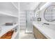 Elegant bathroom with glass-enclosed shower, decorative tile, and modern fixtures at 8505 Blind Pass Dr, Treasure Island, FL 33706