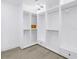 Spacious walk-in closet with custom shelving, drawers, and modern lighting at 8505 Blind Pass Dr, Treasure Island, FL 33706