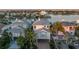 Charming coastal home with covered parking, light exterior, and tropical landscaping at 8505 Blind Pass Dr, Treasure Island, FL 33706