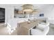 Bright kitchen features a center island with bar seating and a wooden table at 8505 Blind Pass Dr, Treasure Island, FL 33706