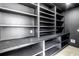 Custom pantry with gray cabinets and granite countertops at 8505 Blind Pass Dr, Treasure Island, FL 33706