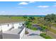 Aerial view of a modern home's side and large garage, with partial views of the bay in the distance at 866 S Davis Blvd, Tampa, FL 33606
