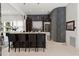 Stylish bar area with granite countertop, dark wood cabinets, and decorative wall tiling at 866 S Davis Blvd, Tampa, FL 33606