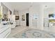 Bright bathroom featuring double vanity, large mirrors, art, and a walk-in shower at 866 S Davis Blvd, Tampa, FL 33606