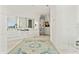 Bright, modern bathroom with a double vanity, large mirrors, and an open shower at 866 S Davis Blvd, Tampa, FL 33606
