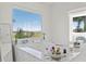Relaxing bathtub with scenic views, surrounded by stylish decor and bright light at 866 S Davis Blvd, Tampa, FL 33606