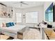 A bright bedroom with modern decor, large windows, and a comfortable bed at 866 S Davis Blvd, Tampa, FL 33606