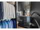 Modern closet design featuring sleek storage cabinets and hanging racks for clothes at 866 S Davis Blvd, Tampa, FL 33606