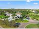 Stunning two-story home boasts lush landscaping, a circular driveway, and a picturesque cityscape backdrop at 866 S Davis Blvd, Tampa, FL 33606