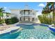 Luxury two-story home with a pool, patio, and balcony, perfect for enjoying outdoor living at 866 S Davis Blvd, Tampa, FL 33606