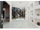 Grand foyer featuring marble floors, a modern staircase, and stylish display niches at 866 S Davis Blvd, Tampa, FL 33606