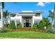 Impressive home with stately columns, meticulous landscaping, and a well-manicured lawn at 866 S Davis Blvd, Tampa, FL 33606