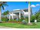Elegant two-story home featuring a grand entrance, beautiful columns, and carefully trimmed landscaping at 866 S Davis Blvd, Tampa, FL 33606