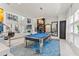 Stylish game room with pool table, modern decor, and open layout into the living area at 866 S Davis Blvd, Tampa, FL 33606