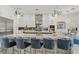 Stylish kitchen with a large marble island, pendant lighting, and stainless steel appliances at 866 S Davis Blvd, Tampa, FL 33606