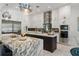Modern kitchen with stainless steel appliances, white cabinets, and a large marble island at 866 S Davis Blvd, Tampa, FL 33606