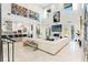 Sun-lit living room features a large white sofa, marble floors, and an open-concept design at 866 S Davis Blvd, Tampa, FL 33606