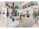 Expansive living area features high ceilings, spiral staircase, modern artwork, and an open kitchen at 866 S Davis Blvd, Tampa, FL 33606