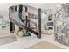 Bright living room showcasing a spiral staircase, marble floors, and modern art pieces at 866 S Davis Blvd, Tampa, FL 33606