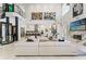 Spacious living room with modern furnishings, an open kitchen, and a spiral staircase at 866 S Davis Blvd, Tampa, FL 33606