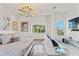 Bright and airy main bedroom with a seating area and views of lush palm trees at 866 S Davis Blvd, Tampa, FL 33606