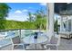 Covered patio features seating area with a glass-paneled view of the pool at 866 S Davis Blvd, Tampa, FL 33606