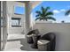 Outdoor patio with seating offers serene treetop views at 866 S Davis Blvd, Tampa, FL 33606