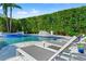 Stunning pool area with lounge chairs and tropical plants, perfect for relaxation at 866 S Davis Blvd, Tampa, FL 33606