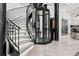 Elegant staircase with an elevator features modern design and marble floors at 866 S Davis Blvd, Tampa, FL 33606