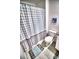 Bathroom featuring a charming shower curtain and modern amenities at 11115 Wishing Cloud Rd, Land O Lakes, FL 34638