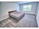 Spacious bedroom features natural light, soft carpet, and calming colors creating a relaxing atmosphere at 11115 Wishing Cloud Rd, Land O Lakes, FL 34638
