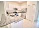 Well-appointed kitchen with granite countertops, stainless steel appliances, and ample cabinet space at 11115 Wishing Cloud Rd, Land O Lakes, FL 34638