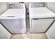 Laundry area with side by side GE washer and dryer, providing convenience and efficiency at 11115 Wishing Cloud Rd, Land O Lakes, FL 34638