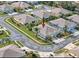 A high angle shot showing the property's location, landscaping, neighboring houses, and street layout at 11439 Golf Round Dr, New Port Richey, FL 34654