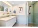 Modern bathroom featuring a glass-enclosed shower, floating vanity, and stylish tile accents at 1200 N Shore Ne Dr # 110, St Petersburg, FL 33701