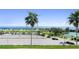 Scenic view of a sandy beach, with palm trees and ocean at 1200 N Shore Ne Dr # 110, St Petersburg, FL 33701