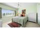 Bedroom with a large window, neutral color, and an area rug at 1200 N Shore Ne Dr # 110, St Petersburg, FL 33701