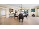 Dining area with chandelier, tile floors, and views into the kitchen and living space at 1200 N Shore Ne Dr # 110, St Petersburg, FL 33701